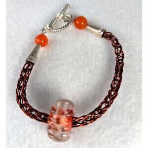 Handmade glass bead on a  handmade viking woven chain bracelet with Toggle7"
